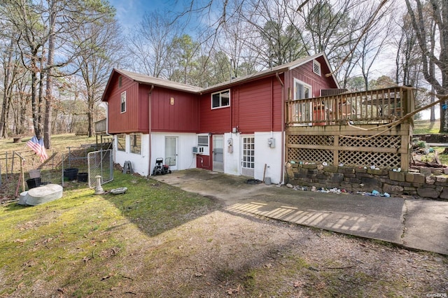 rear view of house featuring a deck