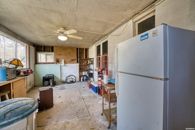 kitchen with a ceiling fan and freestanding refrigerator