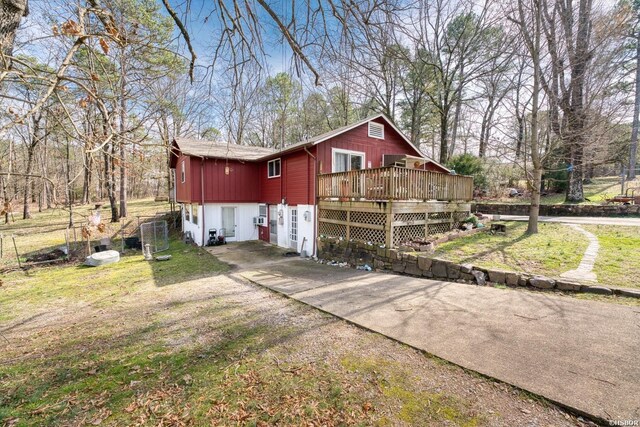 view of property exterior featuring a wooden deck