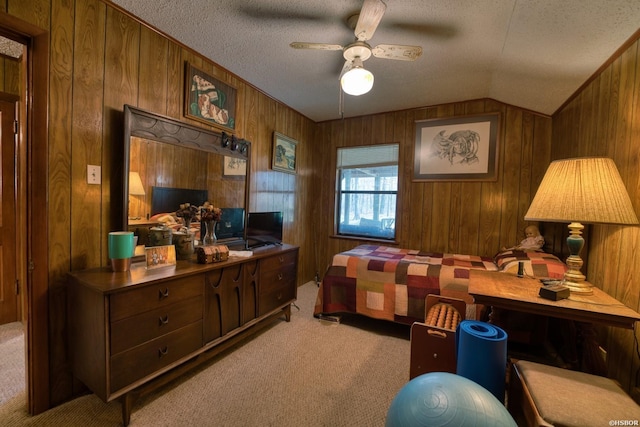 office space featuring light carpet, wooden walls, vaulted ceiling, and a textured ceiling