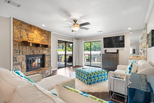 1412 Airport Rd, Hot Springs, AR 71913 - living area featuring wood finished floors, a ceiling fan, a stone fireplace, crown molding, and recessed lighting
