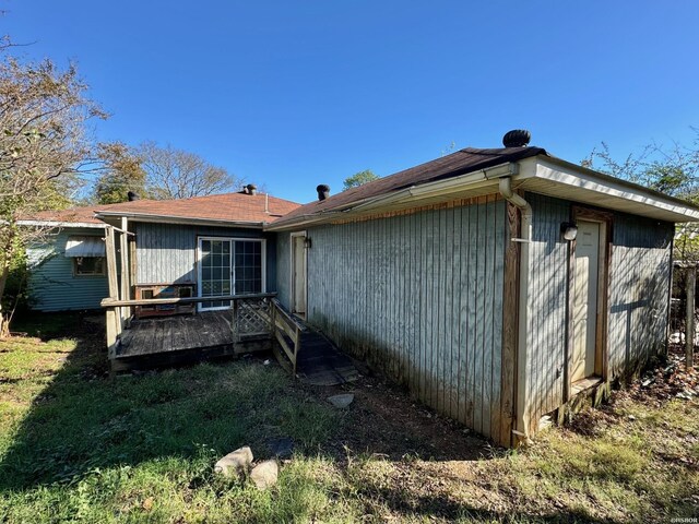 rear view of house with a wooden deck