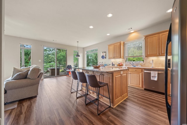 180 Port Au Prince, Hot Springs, AR 71913 - kitchen featuring stainless steel appliances, a center island, a breakfast bar, recessed lighting, and dark wood-style flooring