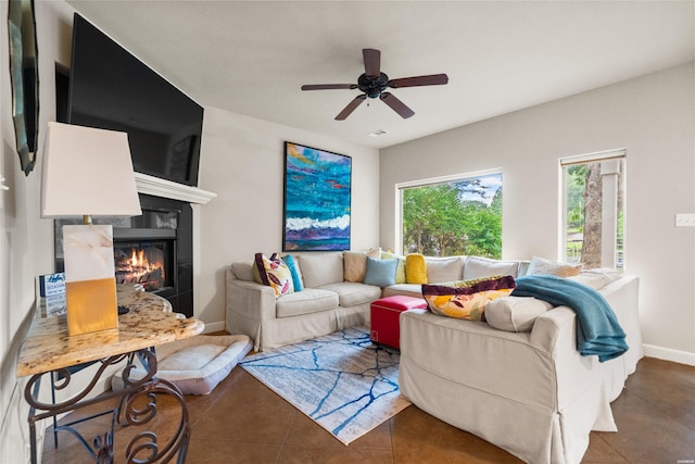 180 Port Au Prince, Hot Springs, AR 71913 - tiled living room featuring a glass covered fireplace, ceiling fan, and baseboards
