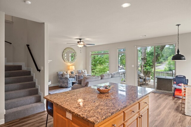 180 Port Au Prince, Hot Springs, AR 71913 - kitchen with light wood-type flooring, light stone counters, a ceiling fan, open floor plan, and recessed lighting