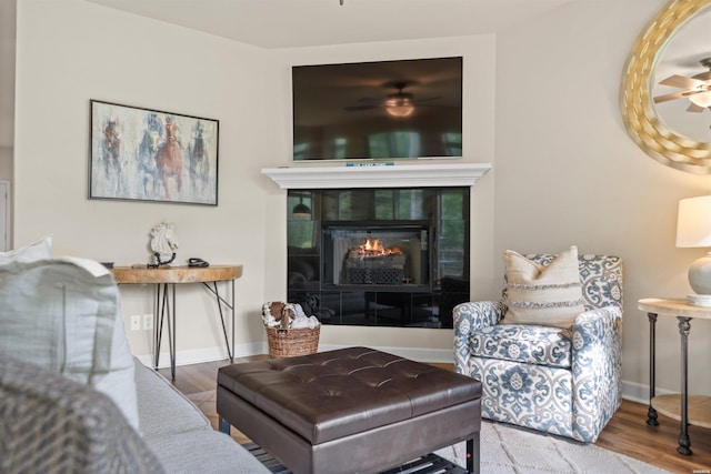 180 Port Au Prince, Hot Springs, AR 71913 - living room featuring a ceiling fan, wood finished floors, a fireplace, and baseboards