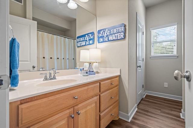 180 Port Au Prince, Hot Springs, AR 71913 - full bathroom with double vanity, wood finished floors, and baseboards
