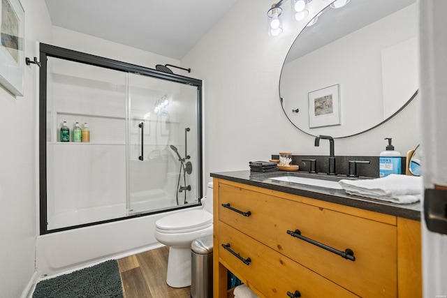 340 Vanadium Cir, Hot Springs, AR 71901 - full bathroom with vanity, bath / shower combo with glass door, wood finished floors, and toilet