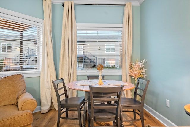 640 Arkridge Rd Unit D6, Hot Springs, AR 71913 - dining room with baseboards, wood finished floors, plenty of natural light, and crown molding