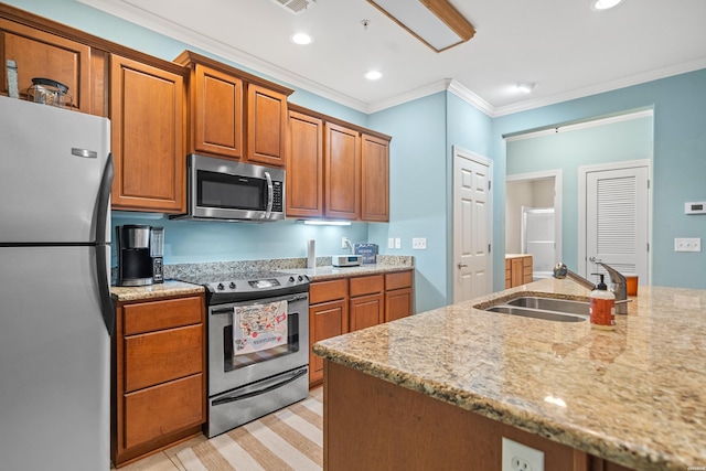 640 Arkridge Rd Unit D6, Hot Springs, AR 71913 - kitchen with stainless steel appliances, a sink, crown molding, brown cabinetry, and light stone countertops