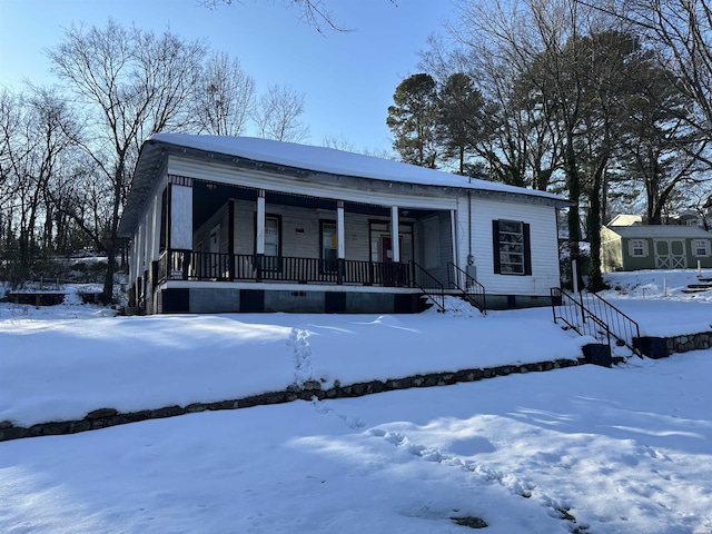 view of front of property with a porch and crawl space