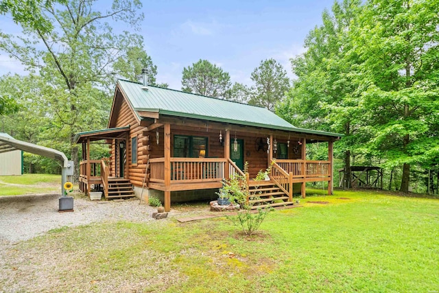 273 Alydar Trl, Hot Springs, AR 71901 - view of front of house with a porch, log exterior, a front lawn, a metal roof, and a carport