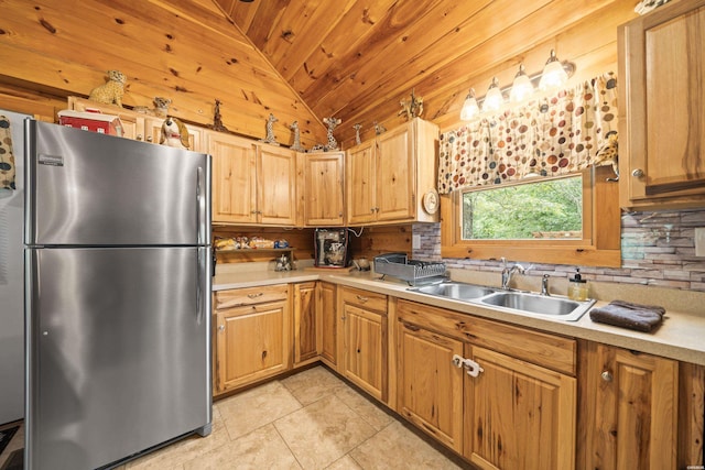 273 Alydar Trl, Hot Springs, AR 71901 - kitchen with freestanding refrigerator, lofted ceiling, wooden ceiling, light countertops, and light tile patterned flooring