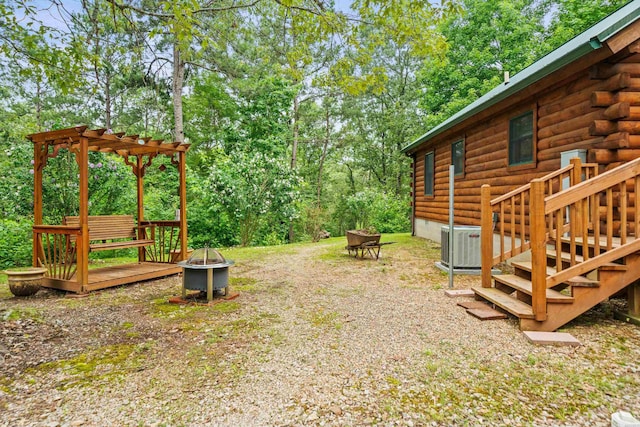 273 Alydar Trl, Hot Springs, AR 71901 - view of yard with an outdoor fire pit, a wooden deck, and a pergola