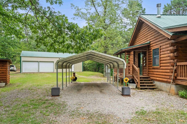 273 Alydar Trl, Hot Springs, AR 71901 - view of grassy yard featuring driveway, a detached carport, and an outbuilding
