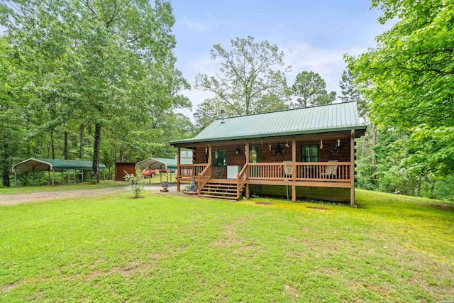 273 Alydar Trl, Hot Springs, AR 71901 - rear view of property with a detached carport, driveway, a yard, and a metal roof