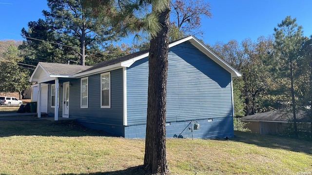 view of property exterior with crawl space and a lawn