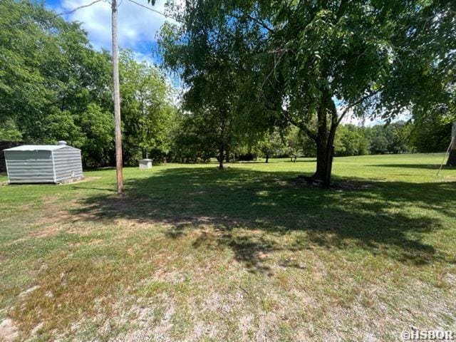 1526 Pearcy Rd, Pearcy, AR 71964 - view of yard featuring a storage shed and an outdoor structure