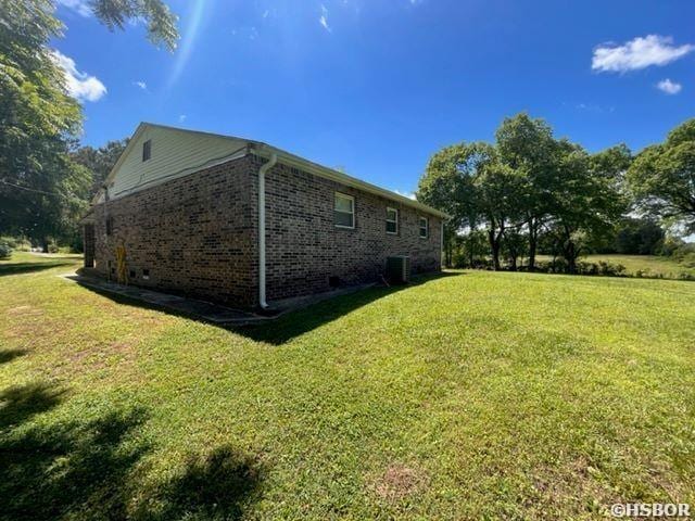 1526 Pearcy Rd, Pearcy, AR 71964 - view of side of home featuring a lawn, brick siding, and central air condition unit
