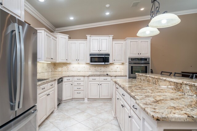 kitchen with tasteful backsplash, appliances with stainless steel finishes, decorative light fixtures, crown molding, and white cabinetry