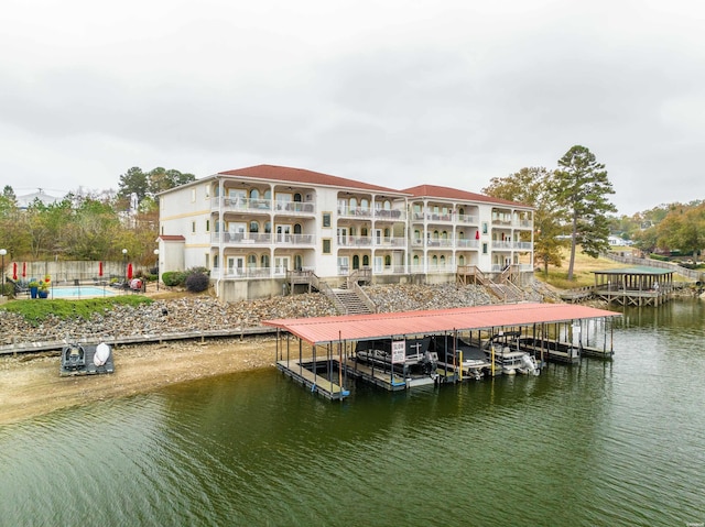 dock area featuring a water view and boat lift