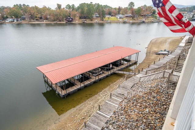 dock area featuring a water view and boat lift