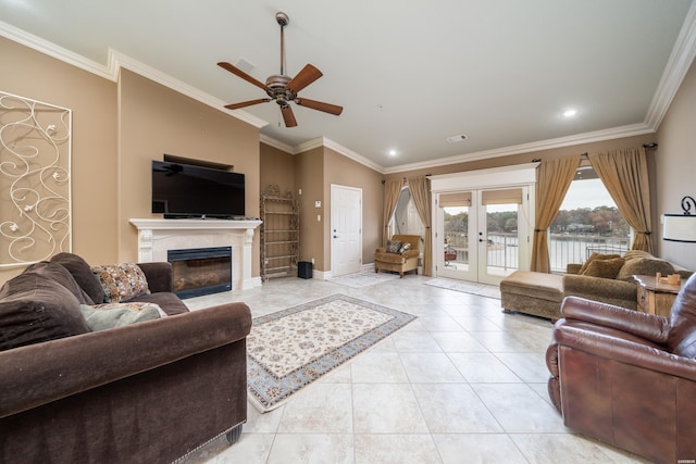 living room featuring french doors, crown molding, and light tile patterned floors