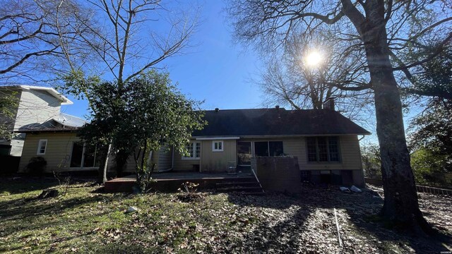 rear view of house featuring a deck