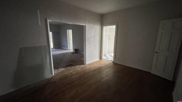 spare room featuring wood finished floors