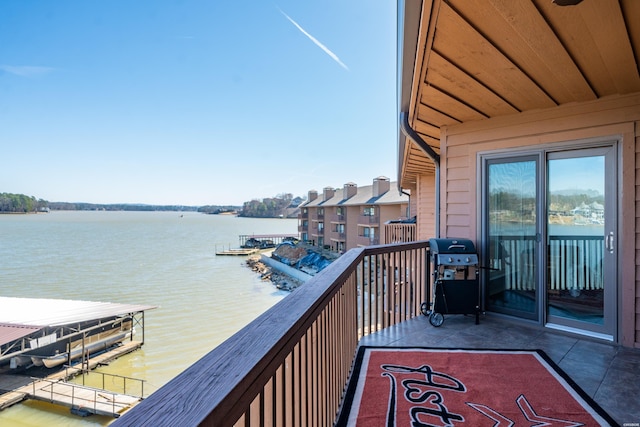 balcony with grilling area and a water view