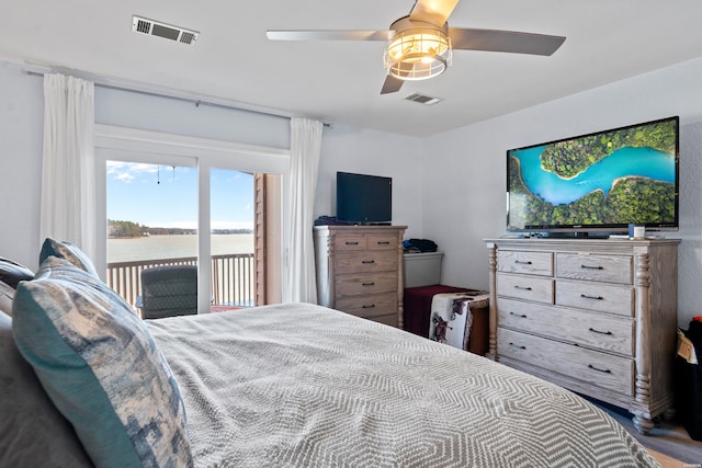 bedroom with access to outside, visible vents, and ceiling fan