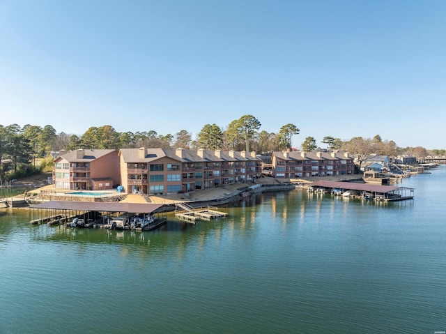 water view with a dock and a residential view