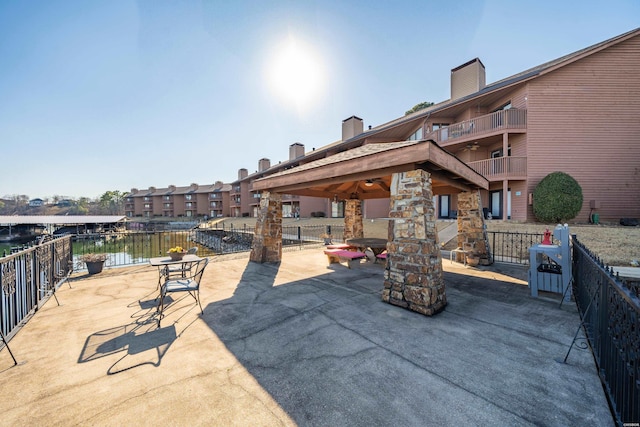 view of patio with a water view