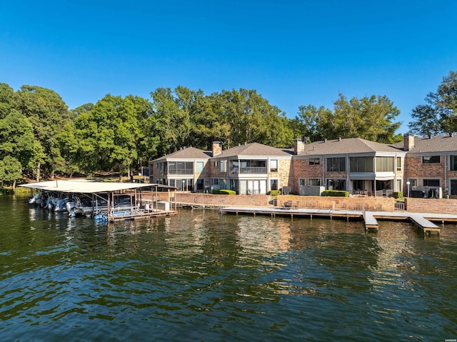 view of dock with a water view and a balcony