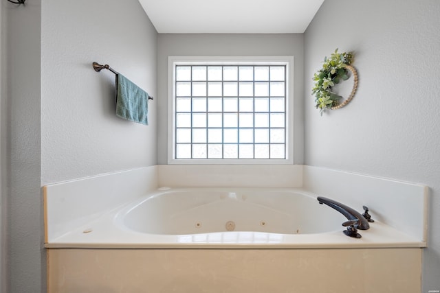 full bathroom with a jetted tub
