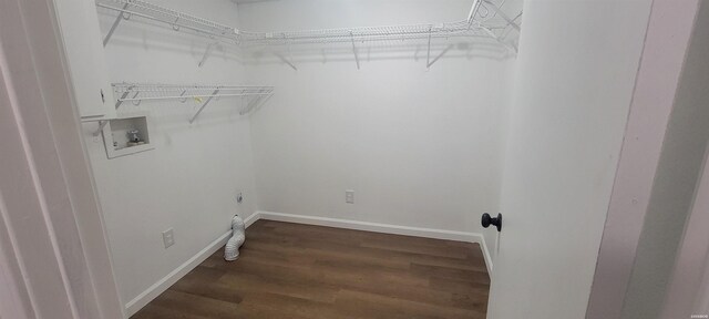 laundry area featuring laundry area, hookup for a washing machine, dark wood finished floors, and baseboards