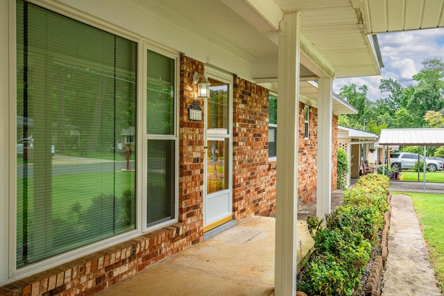 entrance to property with board and batten siding and brick siding