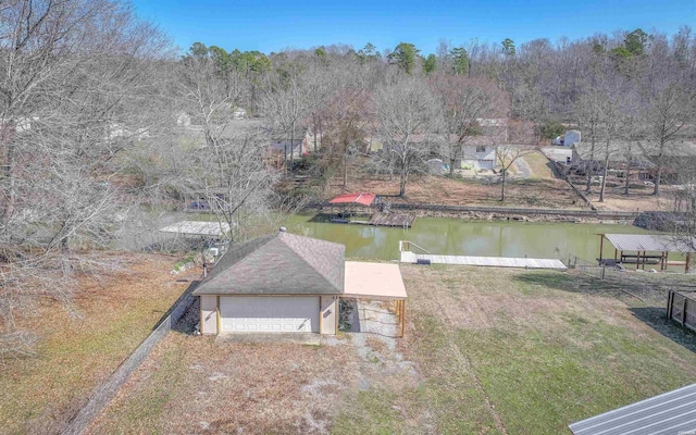 view of dock featuring a yard and a water view