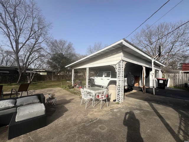 view of patio / terrace featuring fence