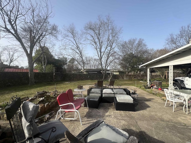 view of patio / terrace featuring a fenced backyard and an outdoor living space with a fire pit