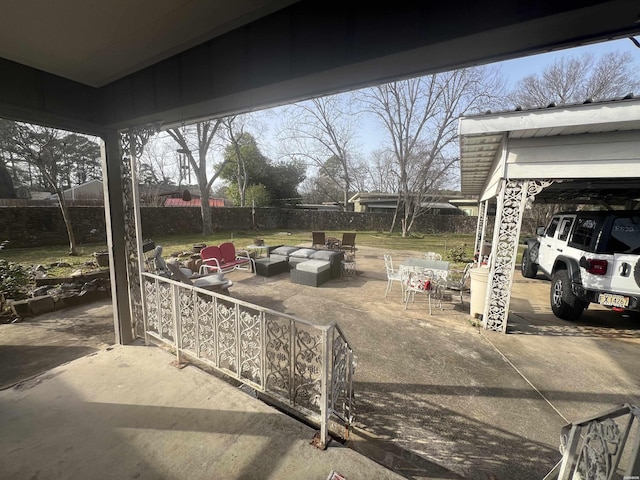 view of patio featuring an outdoor hangout area and fence