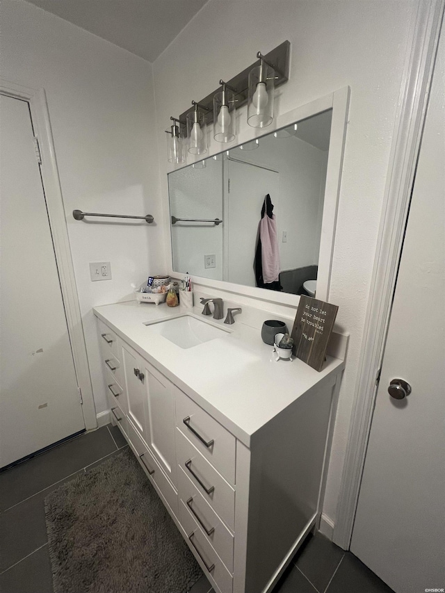 bathroom with tile patterned flooring and vanity