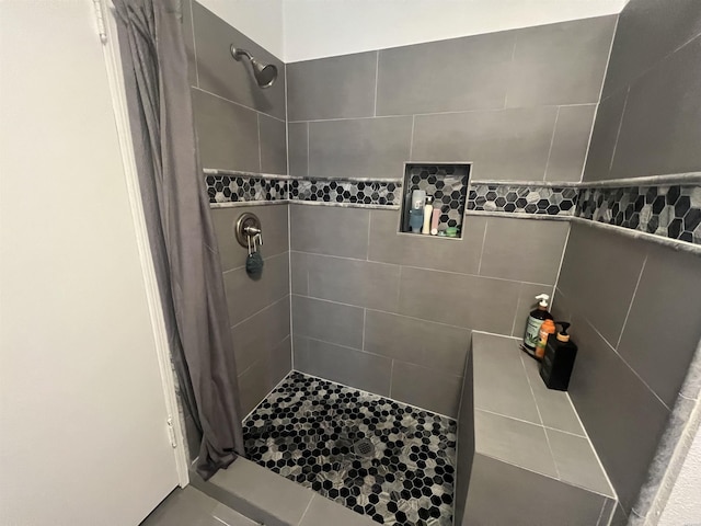 full bathroom with a tile shower