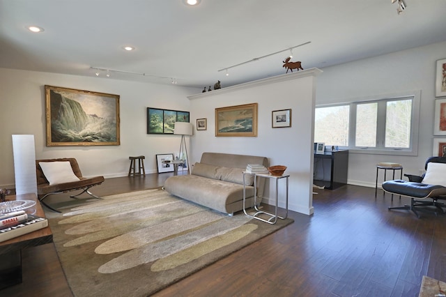 living room featuring baseboards, dark wood-type flooring, and recessed lighting