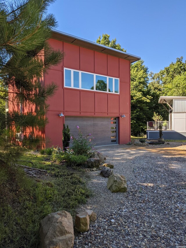 view of home's exterior featuring driveway and stucco siding