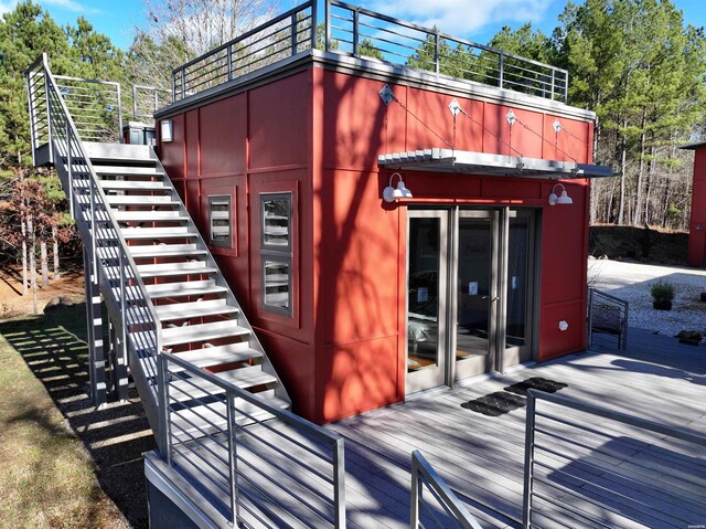 exterior space featuring stairway and a wooden deck