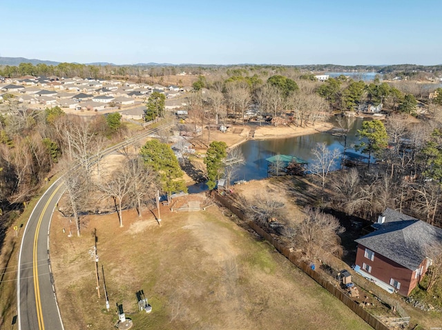 birds eye view of property with a water view and a residential view