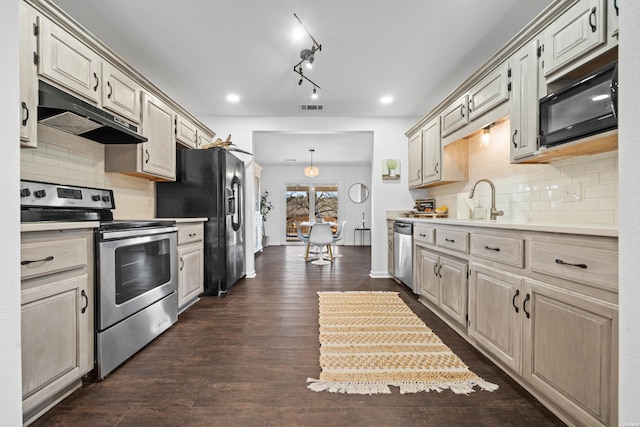 kitchen featuring visible vents, light countertops, under cabinet range hood, and black appliances