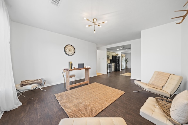 interior space with baseboards, dark wood-type flooring, visible vents, and an inviting chandelier