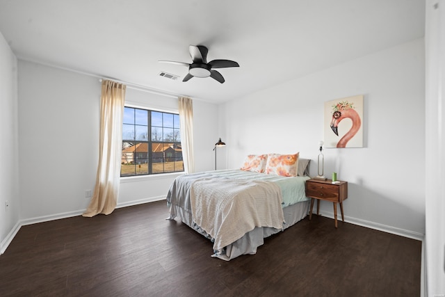 bedroom with dark wood-type flooring, visible vents, and baseboards